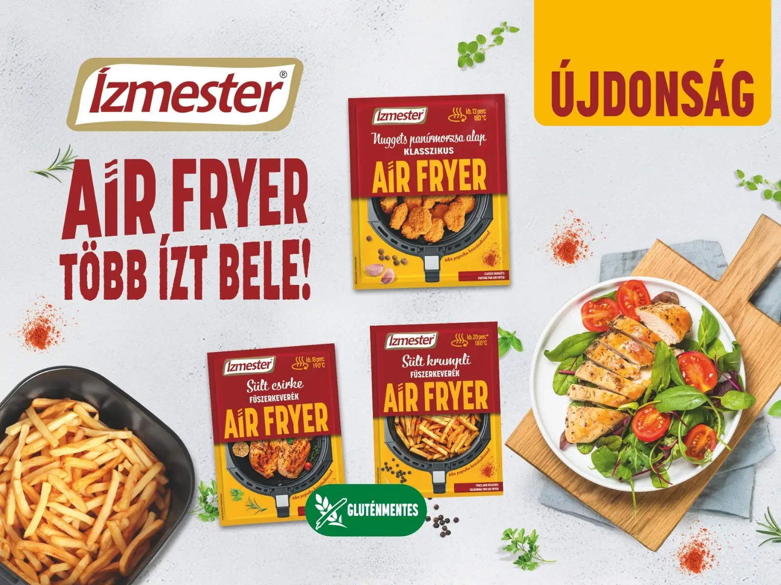 Ízmester Air Fryer fűszerkeverékek asztalra pakolva, mellettük air fryerben készített sült krumpli és grill csirke salátával egy tányéron.